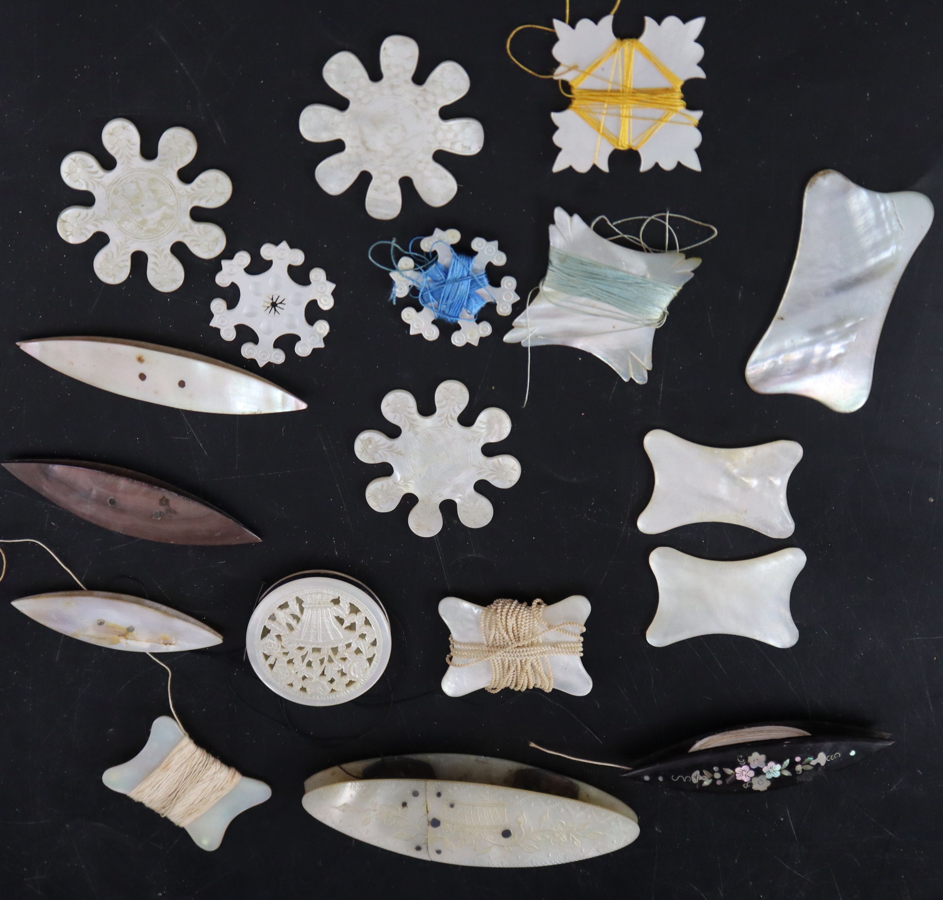 Eighteen assorted early to mid 19th century silk winders largest 9cm